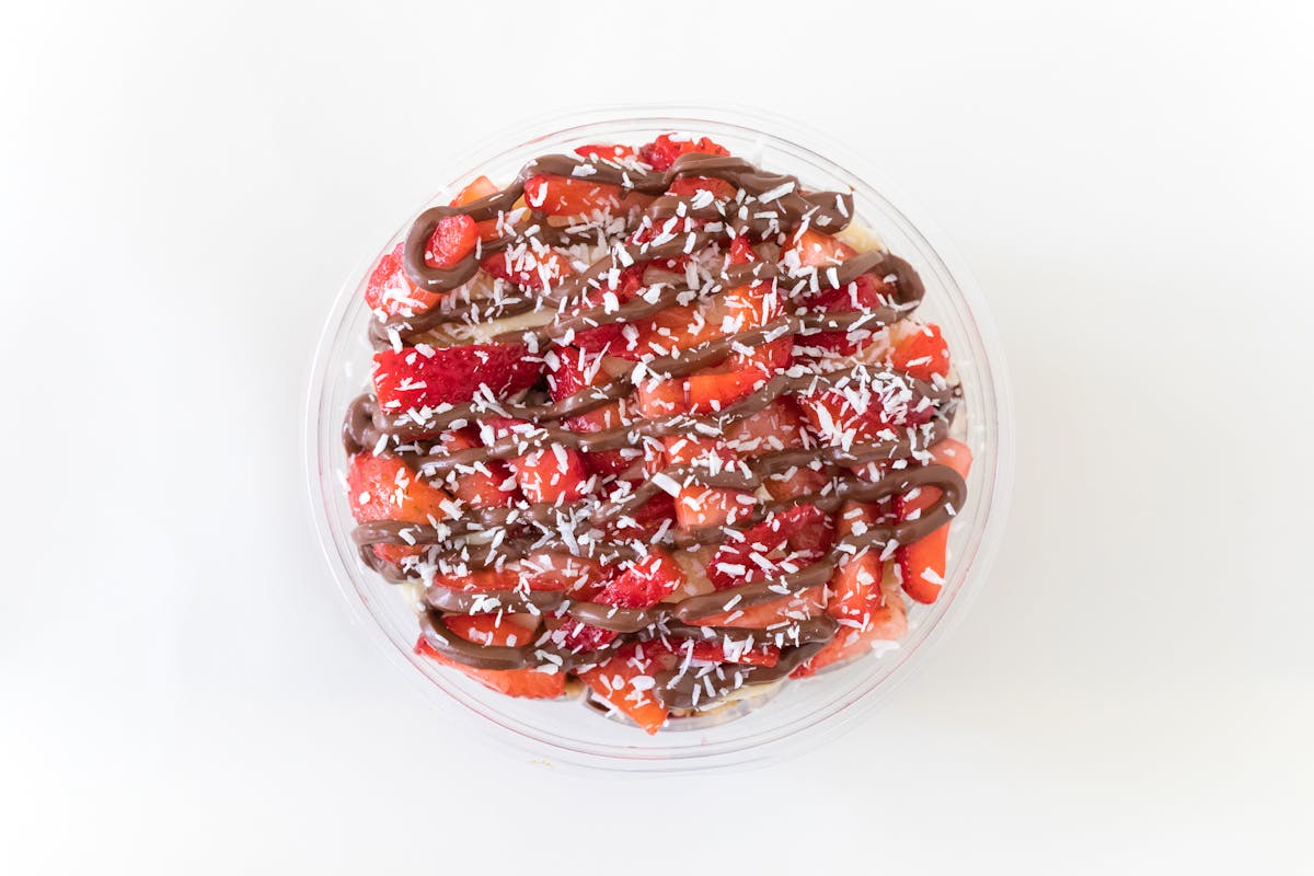 a bowl of fruit on a table