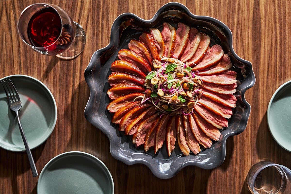 a plate of food sitting on top of a wooden table