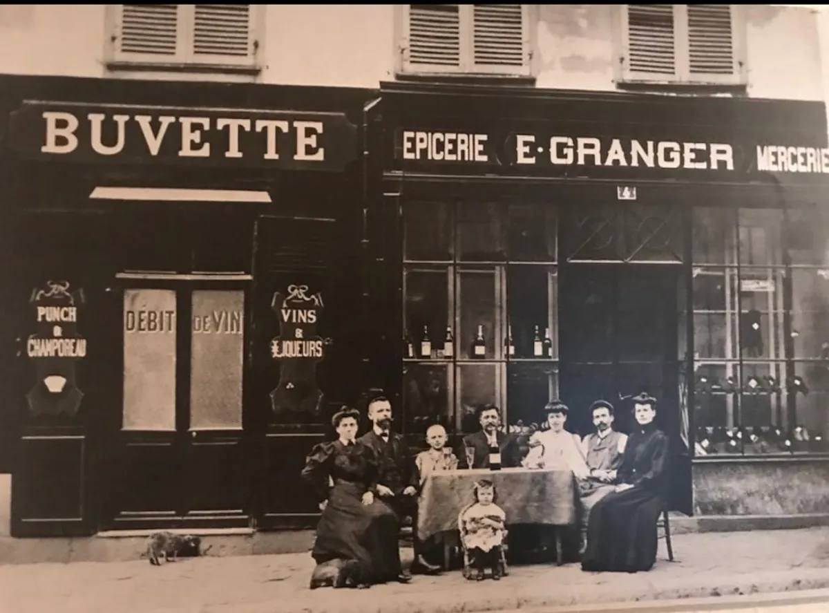 a group of people standing in front of a store