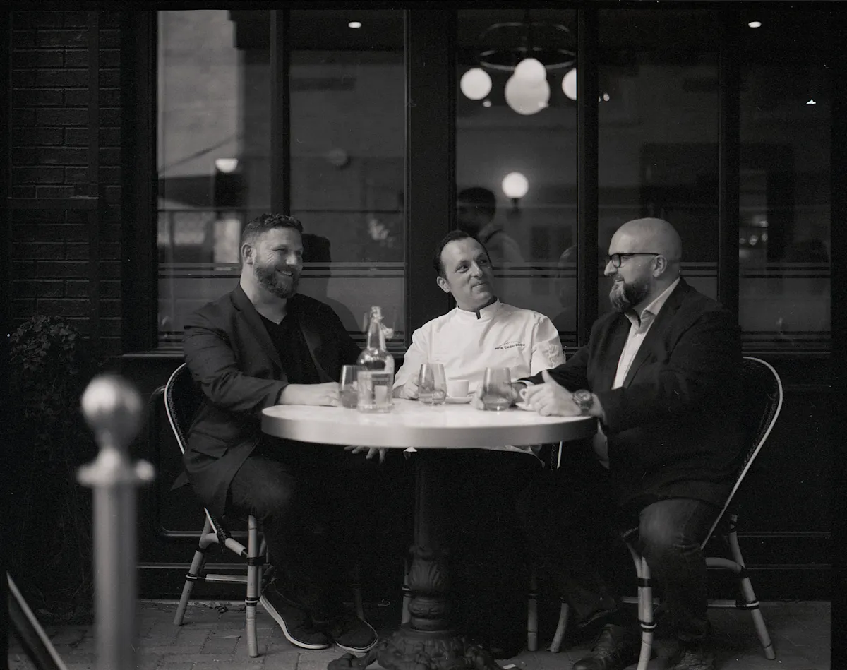 a group of people sitting at a table