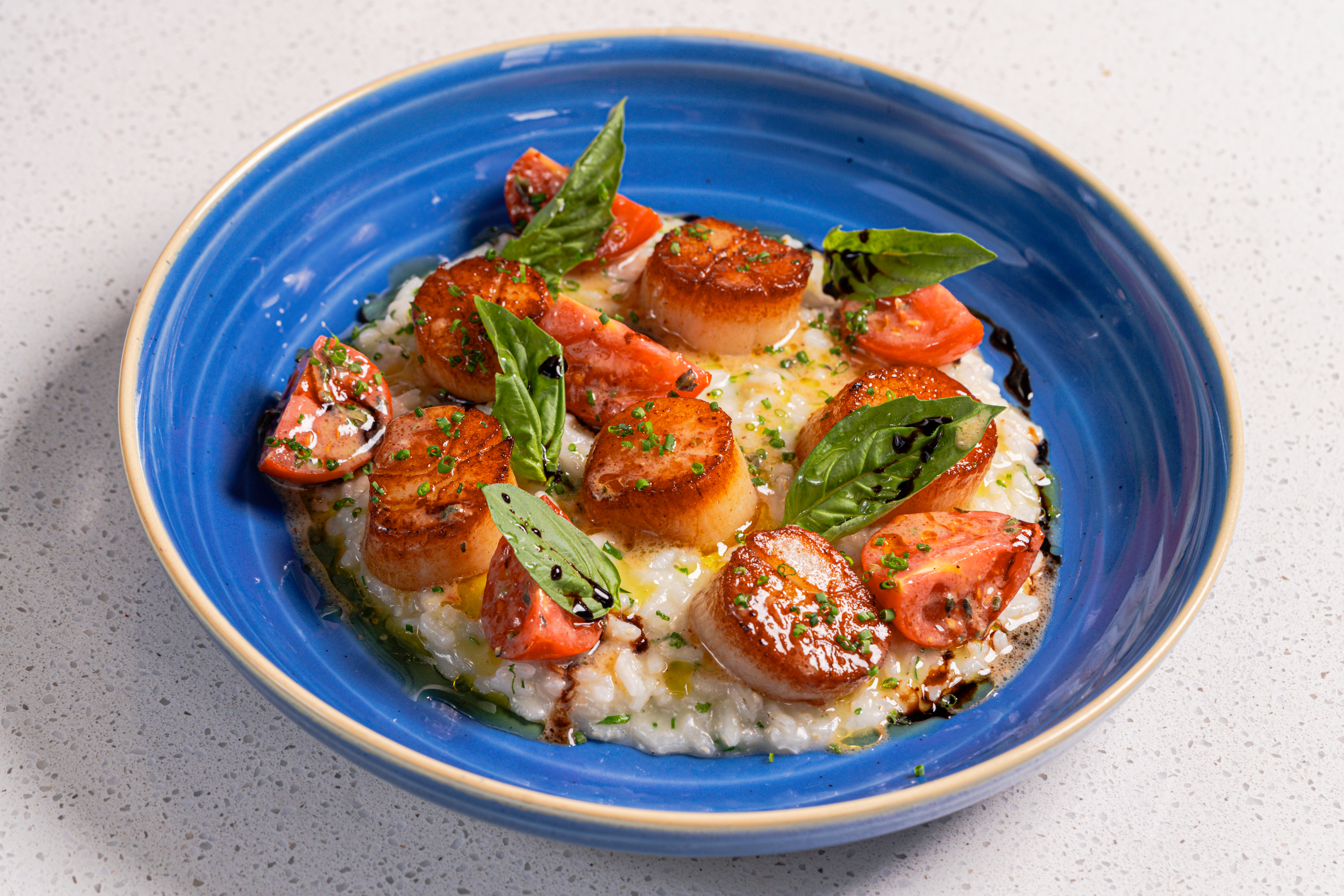 a blue bowl with food on it