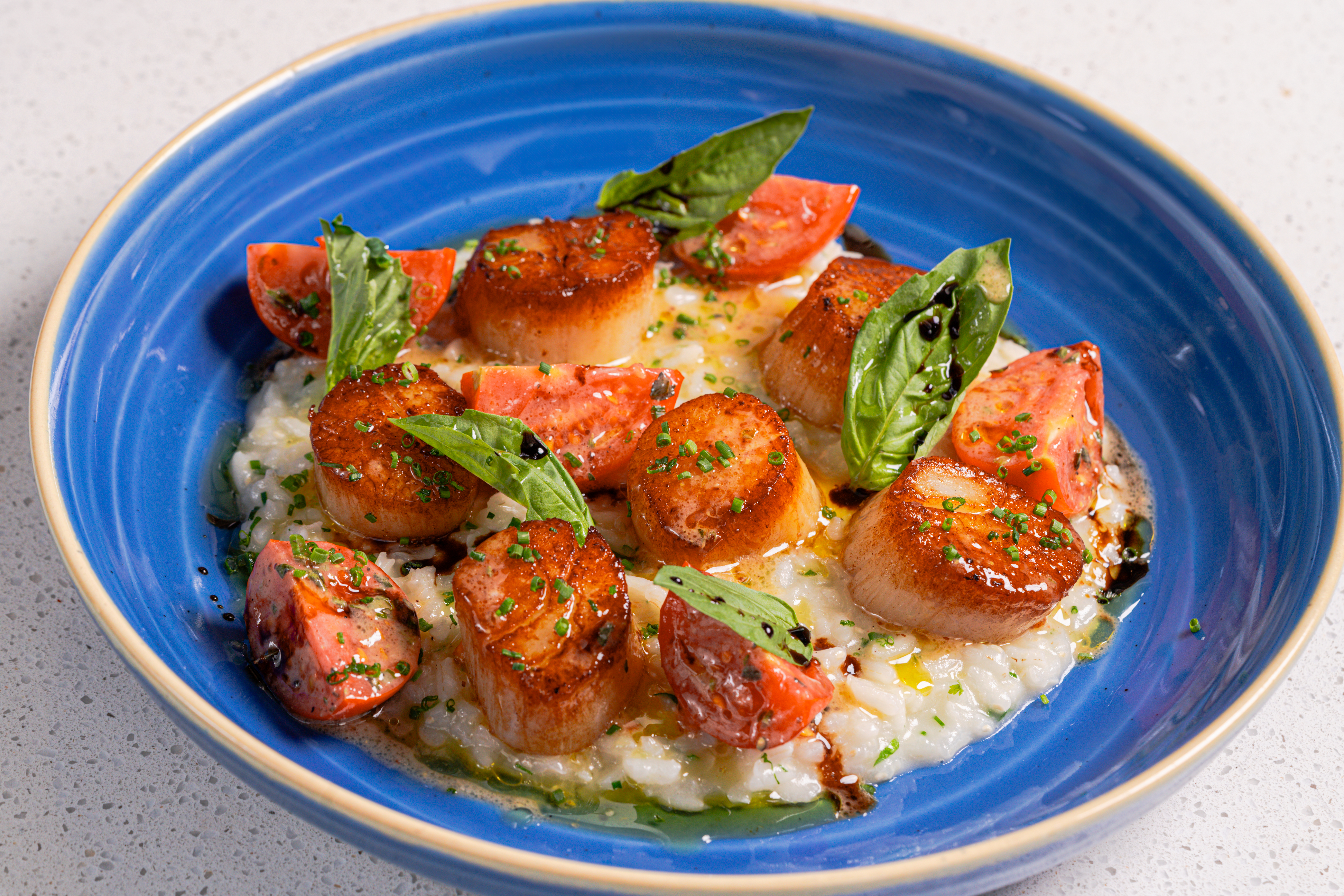 a blue bowl with food on it