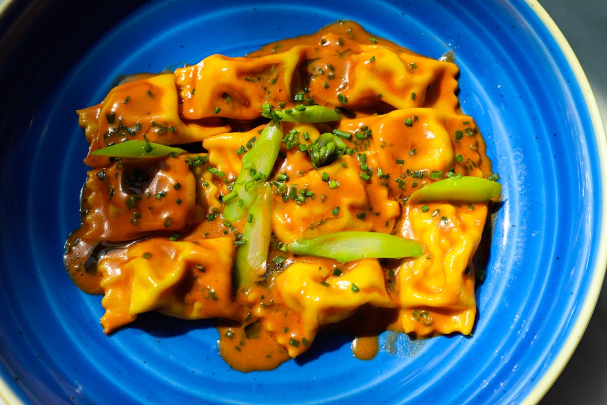 a close up of food on a blue plate