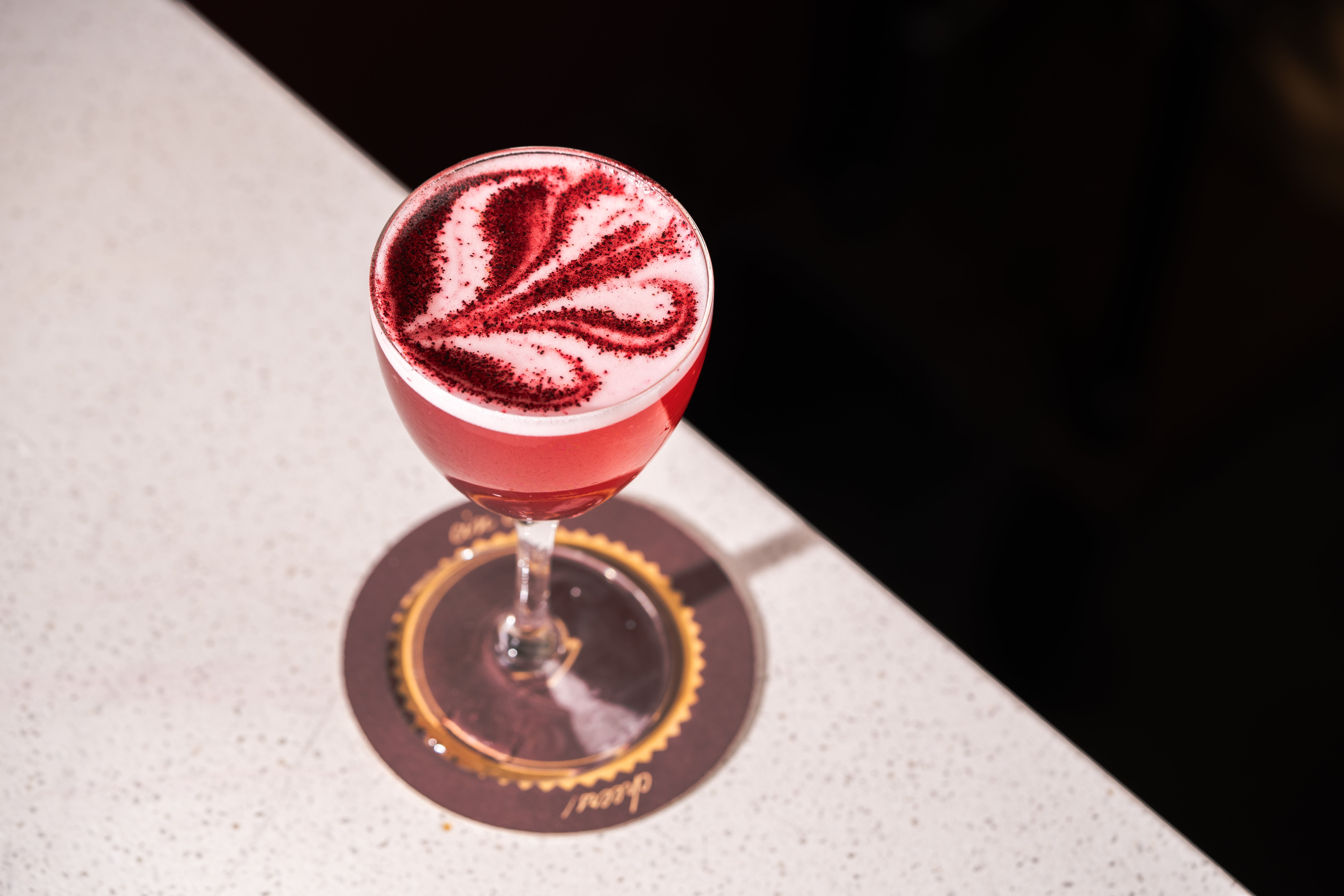 a glass with a red liquid in it