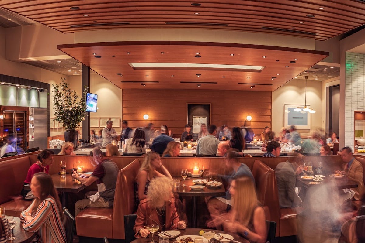 a group of people sitting at a table in a room
