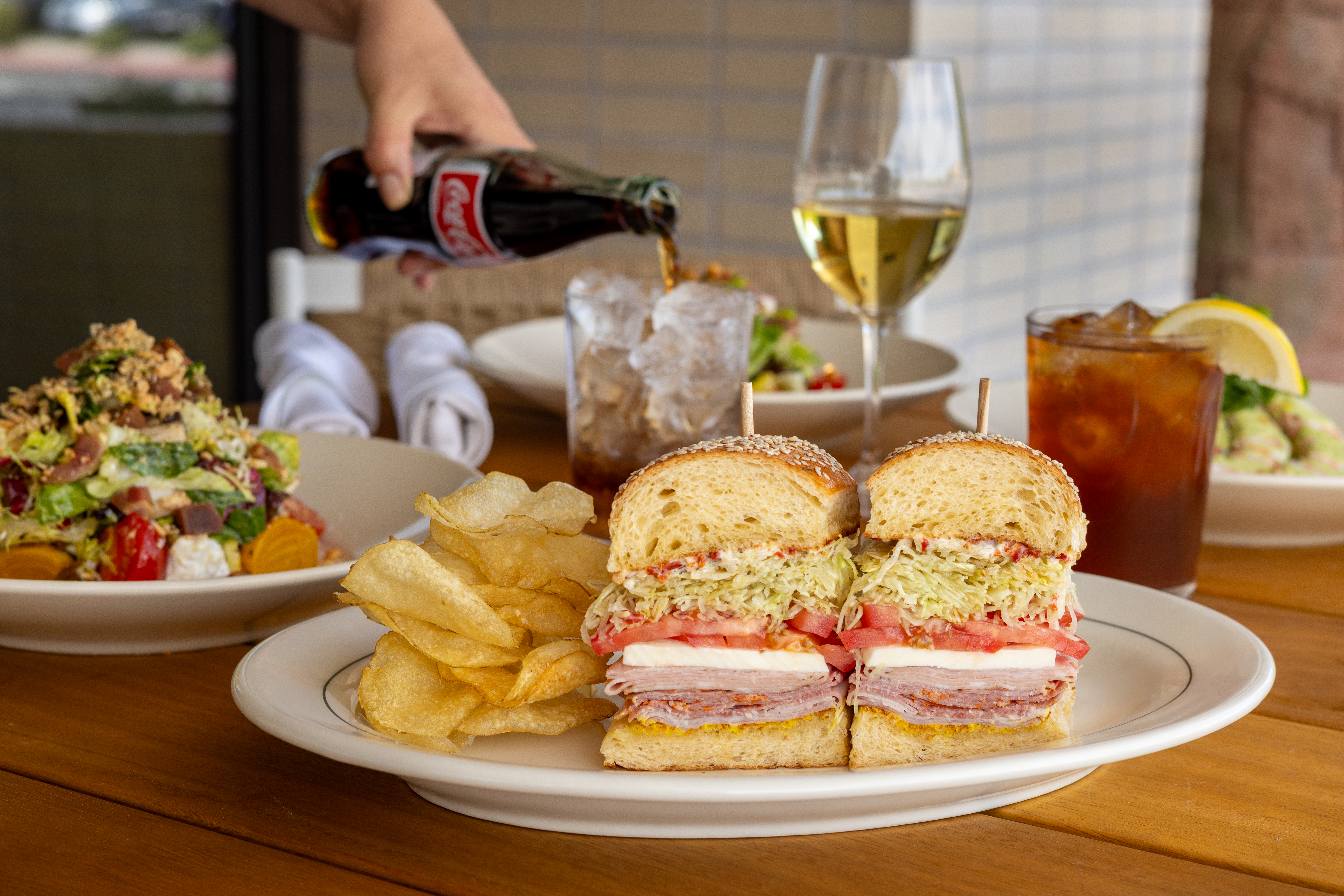 a plate of food with a sandwich and a drink