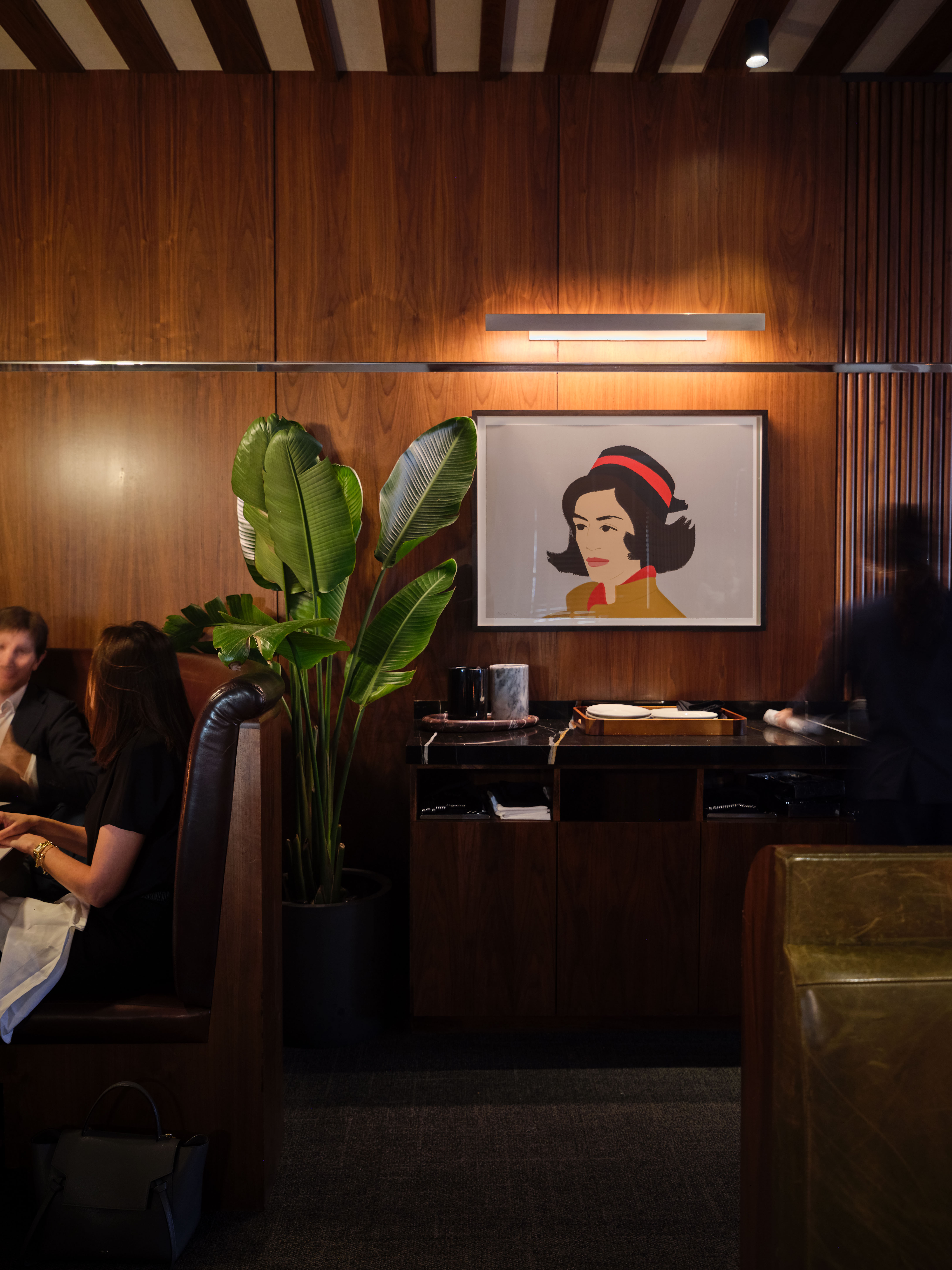 a person sitting at a table in a room