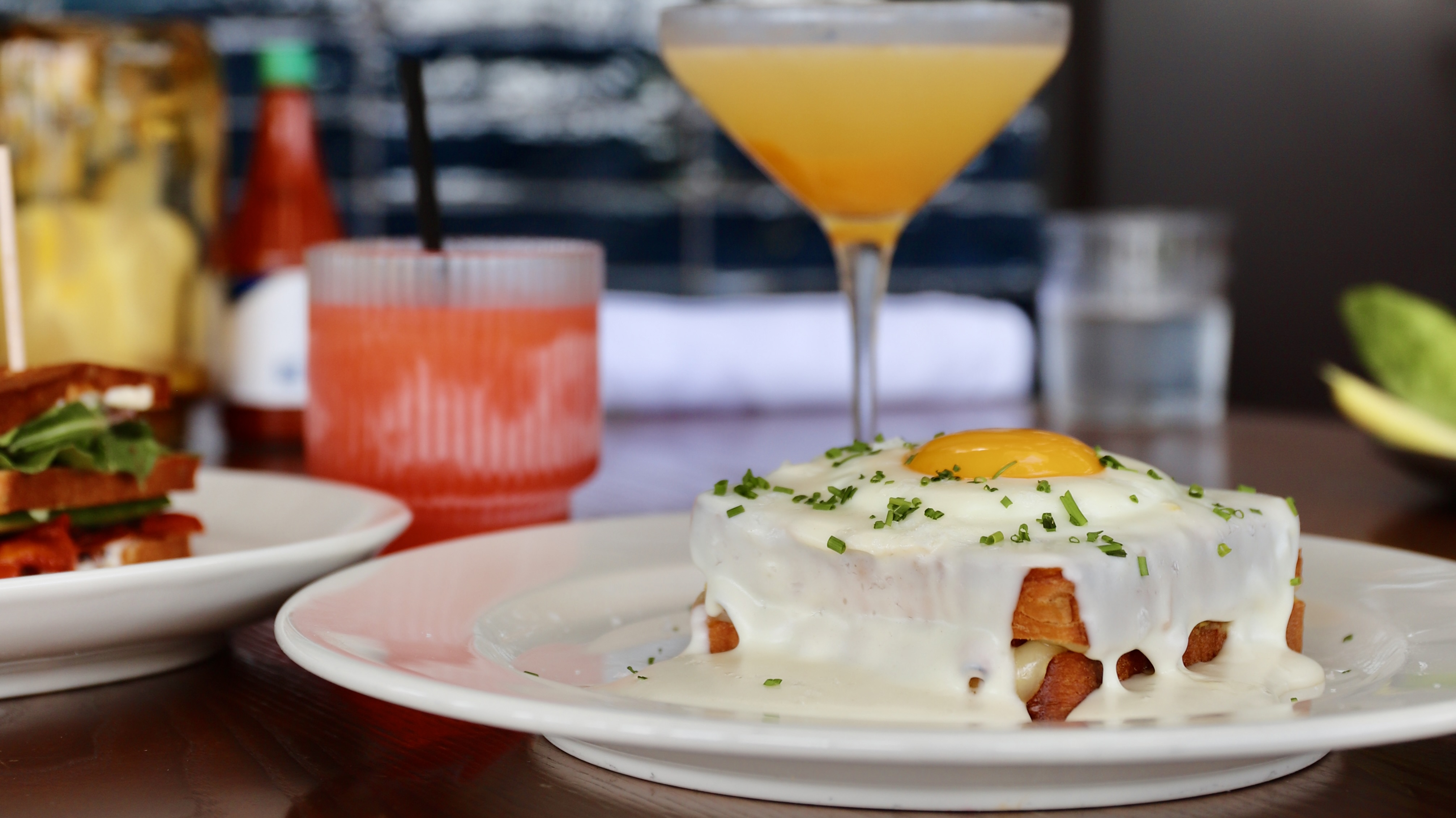 a close up of a plate of food and a glass of wine