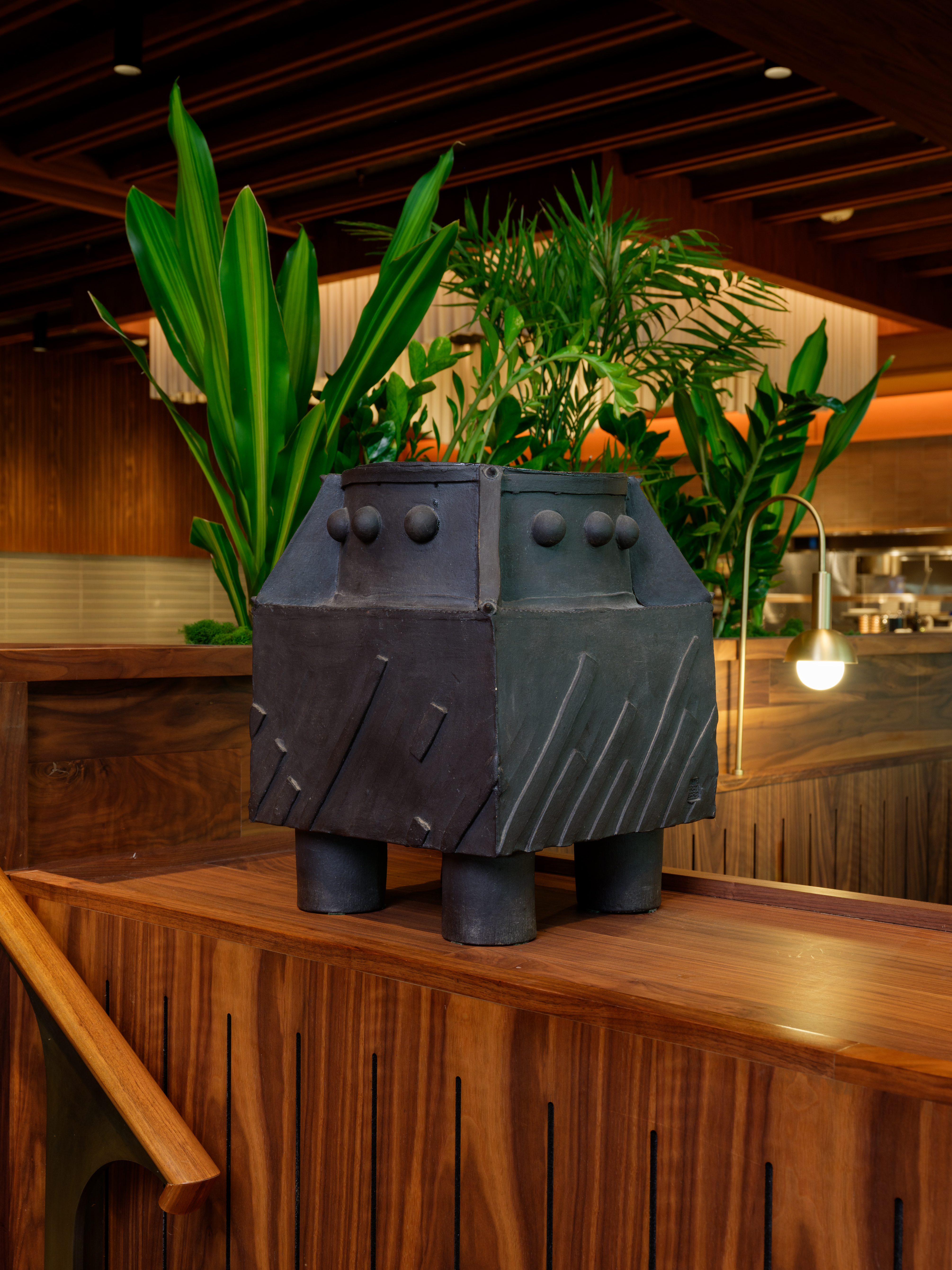 a vase of flowers sitting on top of a wooden table