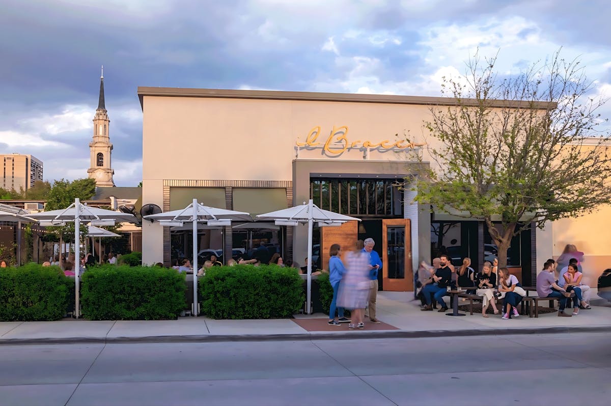 a person sitting in front of a building