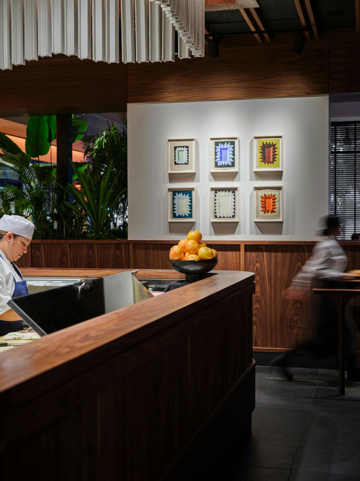a person sitting at a table in a restaurant