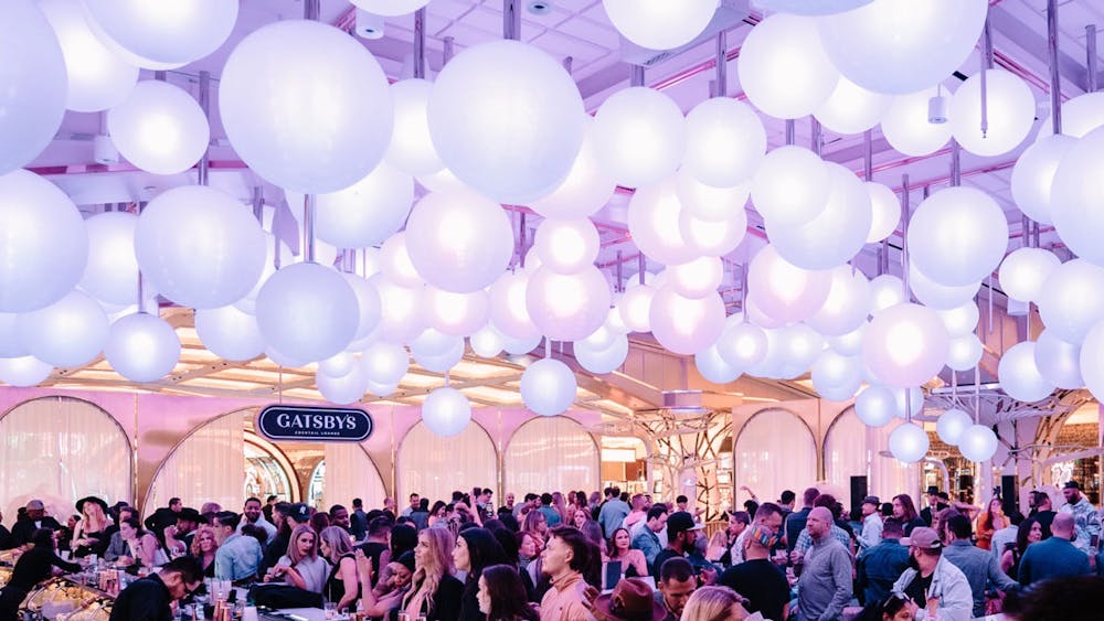 Immerse yourself in the heart of Las Vegas' New Year's Eve celebrations at Gatsby's, where the ambiance is as effervescent as the champagne bubbles! This breathtaking image showcases a sea of revelers under a canopy of glowing white orbs, creating an enchanting atmosphere perfect for welcoming the New Year. As the premier destination for NYE in Vegas, Gatsby's offers an unforgettable experience with its opulent setting and lively crowd, guaranteeing a festive start to the year in a city that never sleeps. Join us for a night where every moment is a celebration!