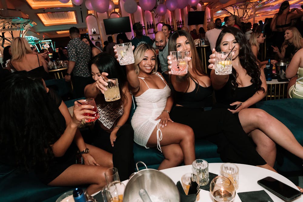 a group of women posing for a photo