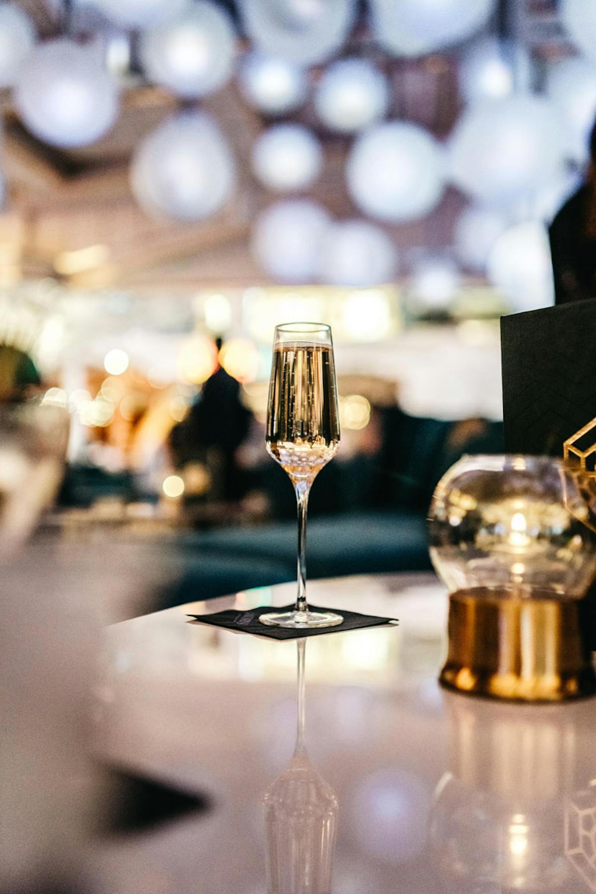 a glass of champagne on a table
