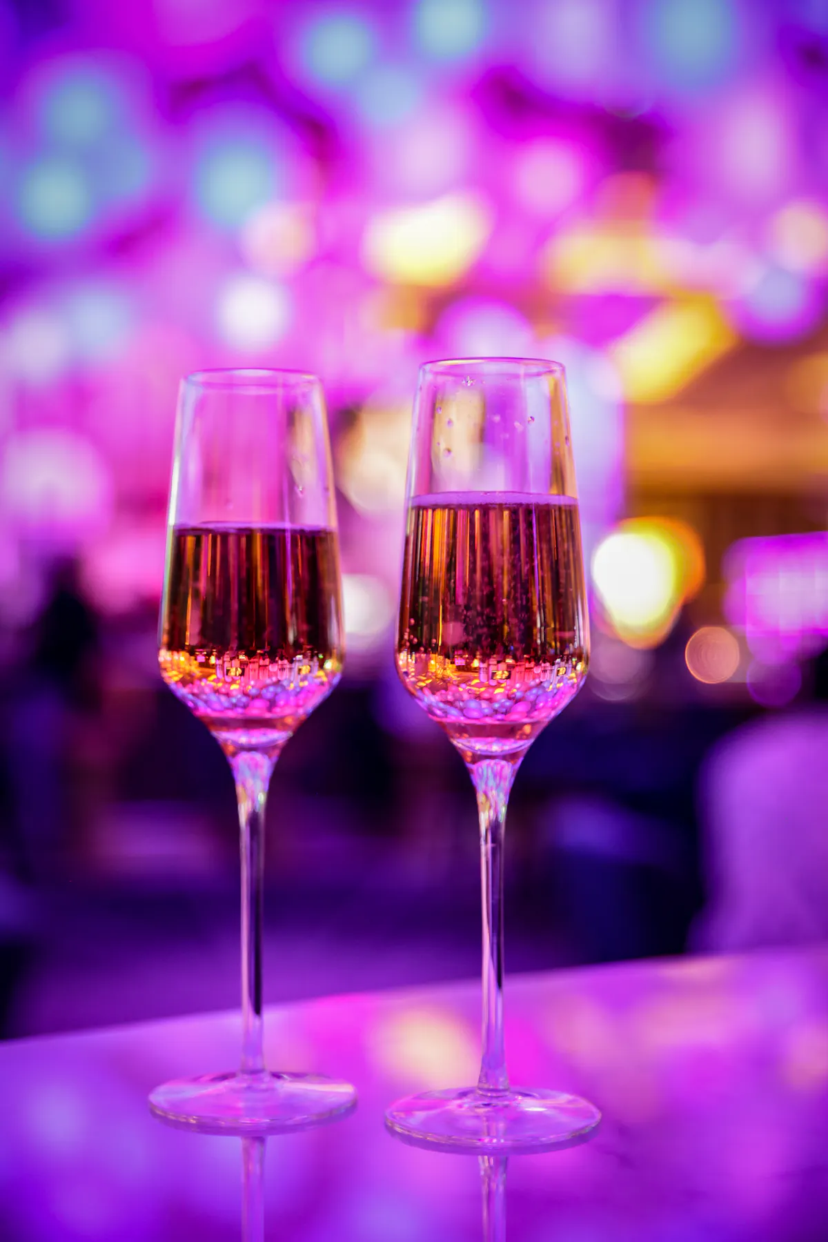 two glasses of champagne on a table