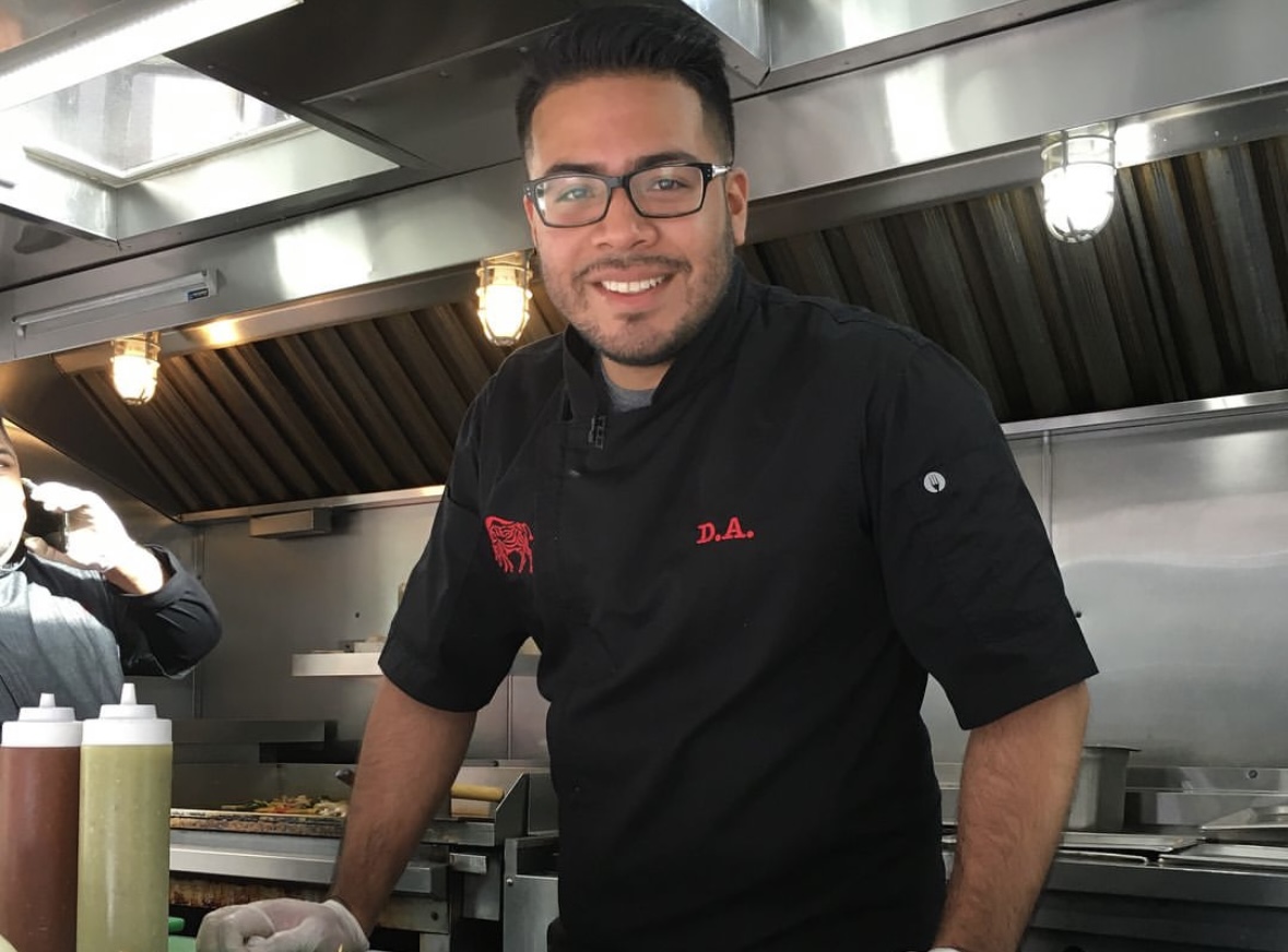César Jiménez standing in a kitchen