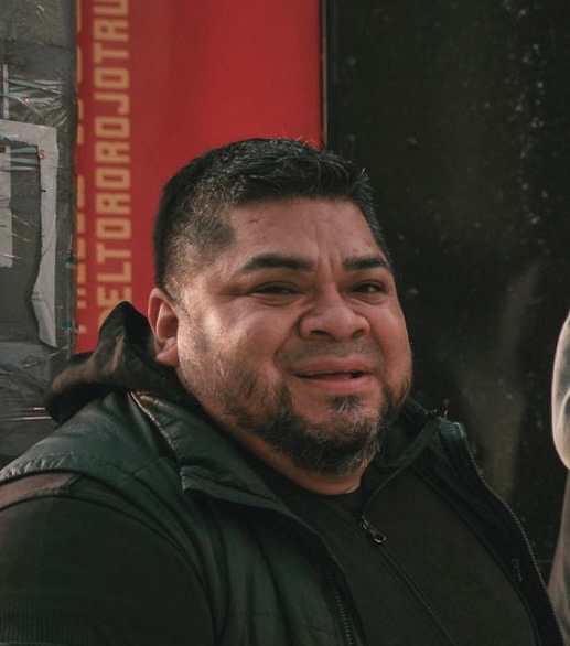 a man standing in front of a building
