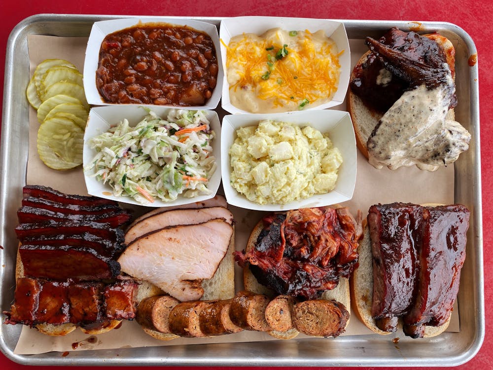 a box filled with different types of food on a plate