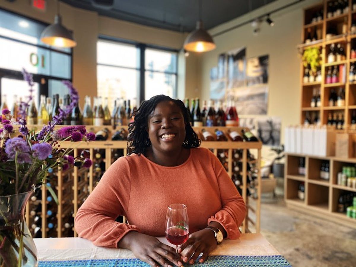a woman sitting at a table in a restaurant