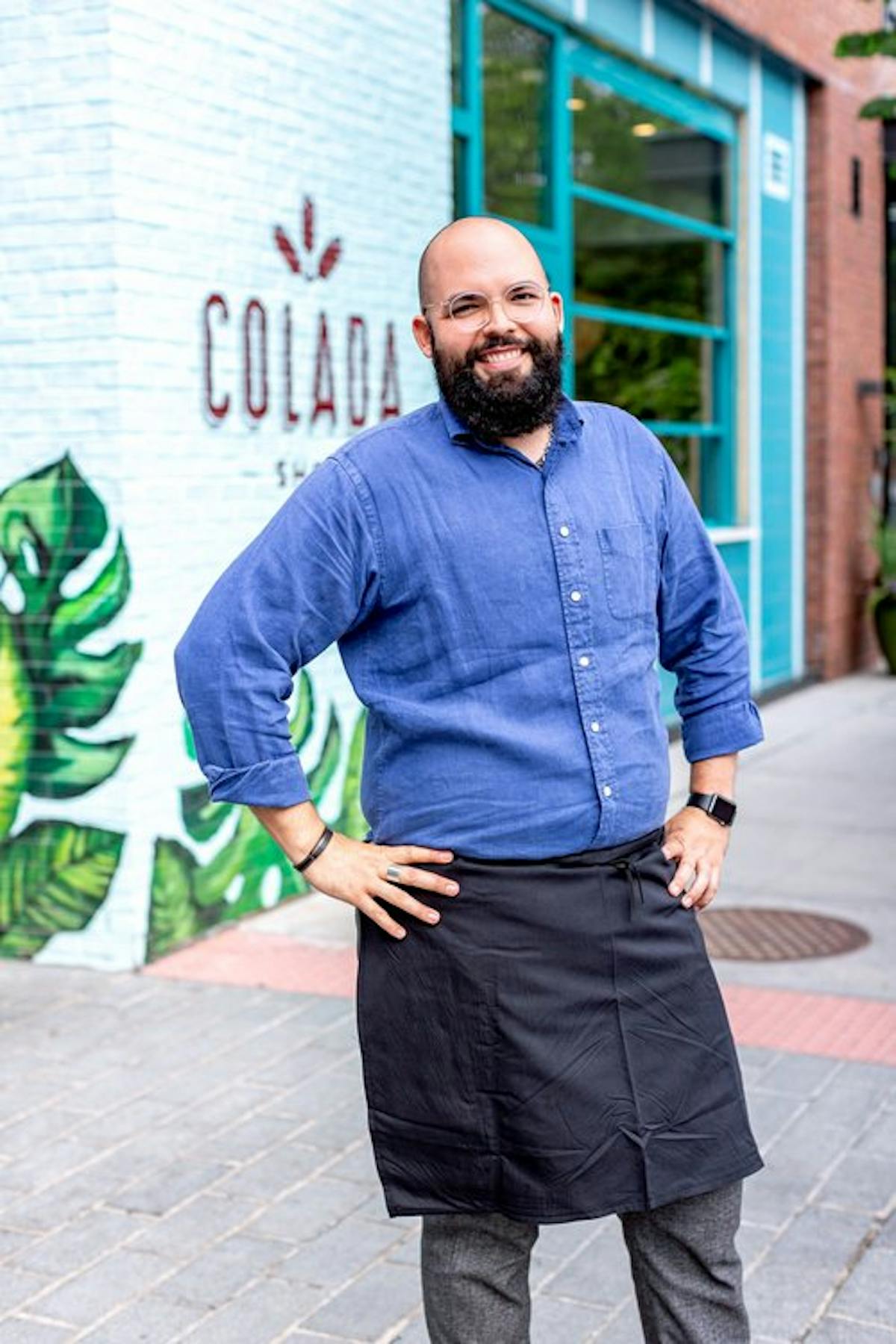 a man standing on a sidewalk