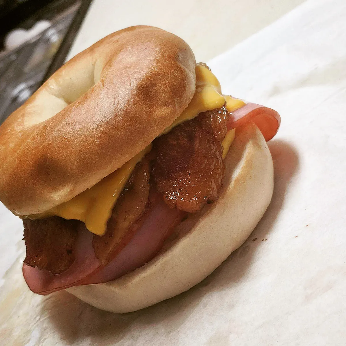 Hollywood Canteen: buttered and toasted breakfast bagel, scrambled egg, American cheese with ham