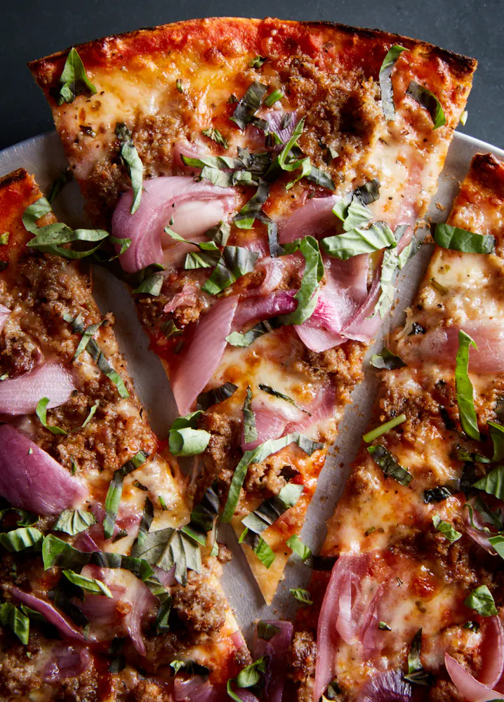 a close up of a slice of pizza