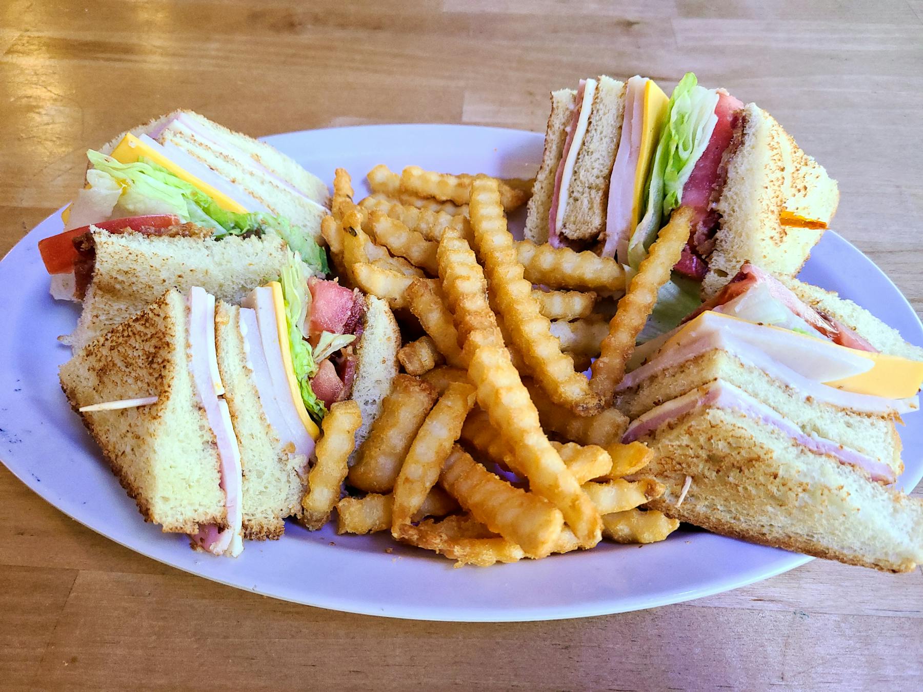 a sandwich and fries on a plate
