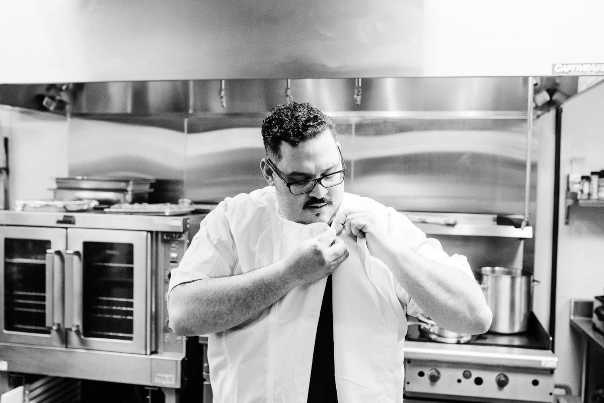 a man standing in a kitchen