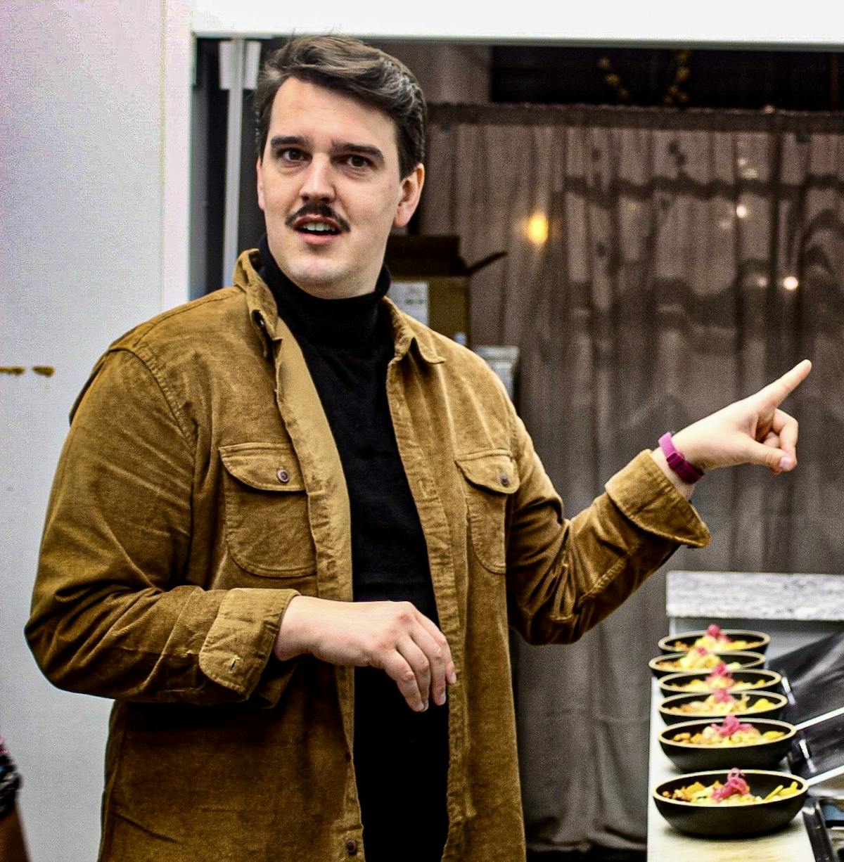 a man standing next to a woman