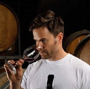 a man holding a wine glass