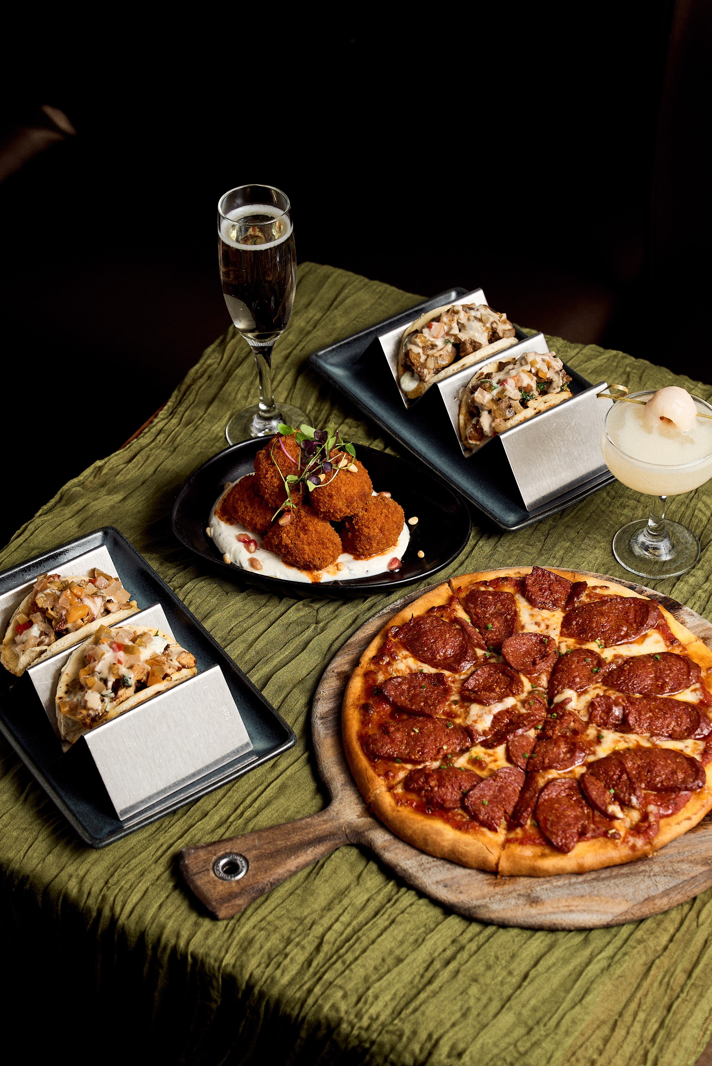 a pizza sitting on top of a wooden table