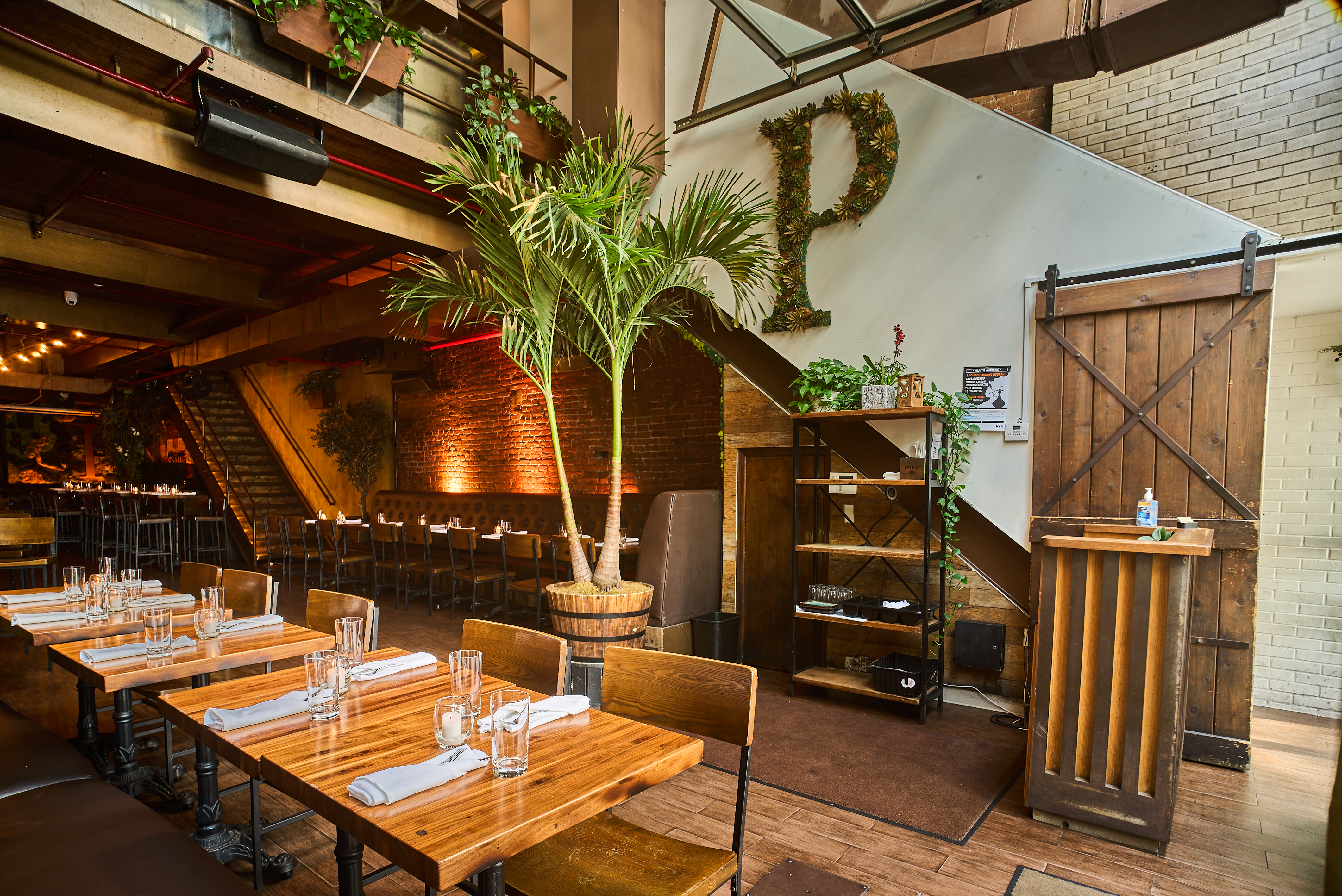a group of people sitting at a table in a restaurant