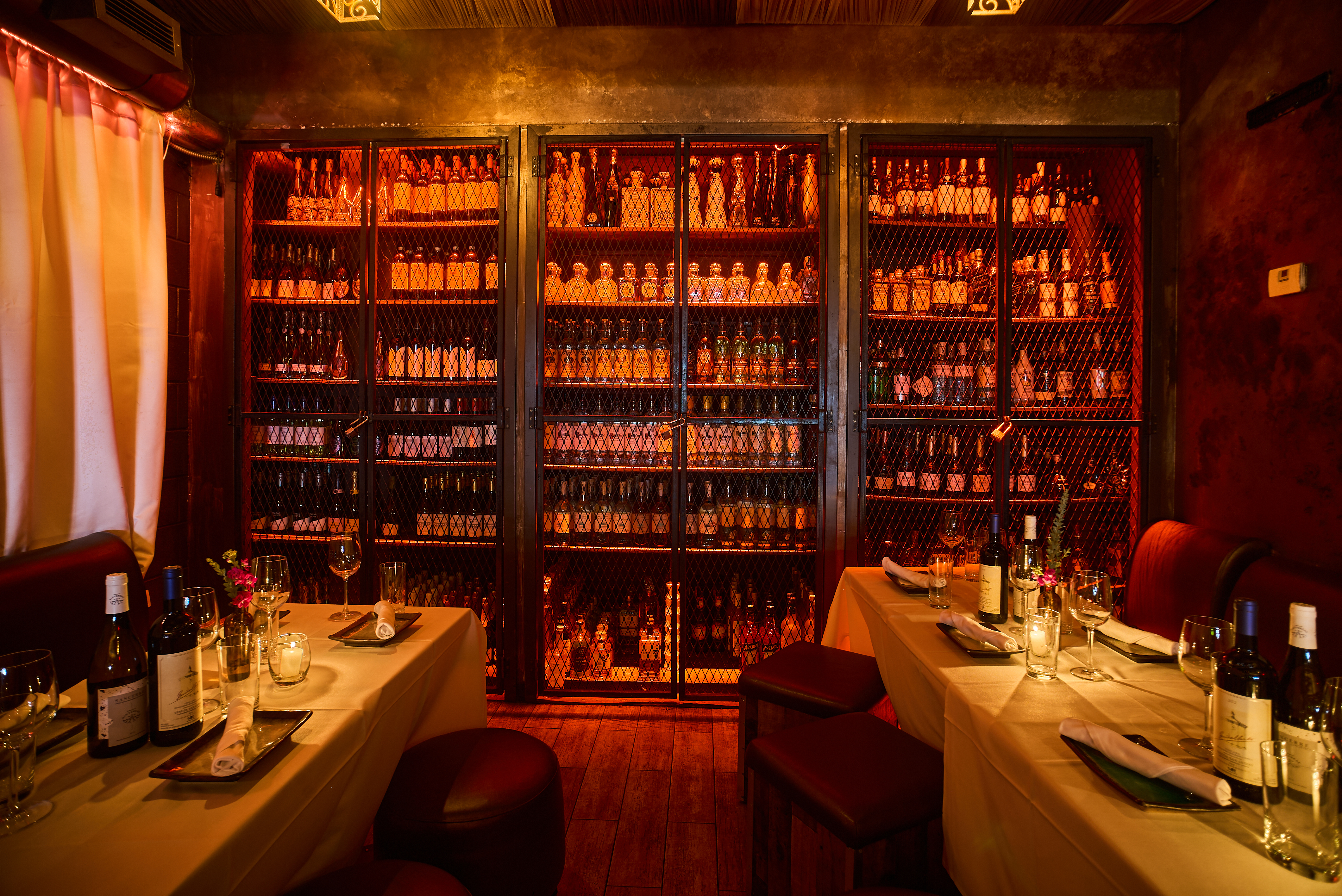 a bunch of vegetables on display lit up at night