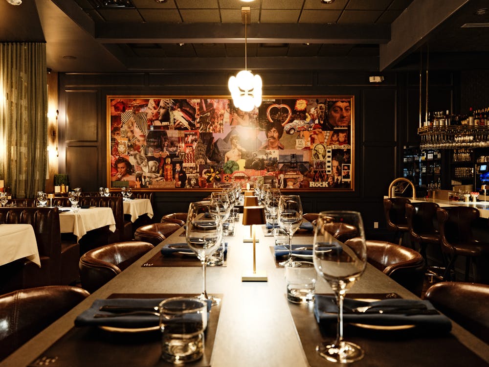 a kitchen with a lot of people that are set up on a table