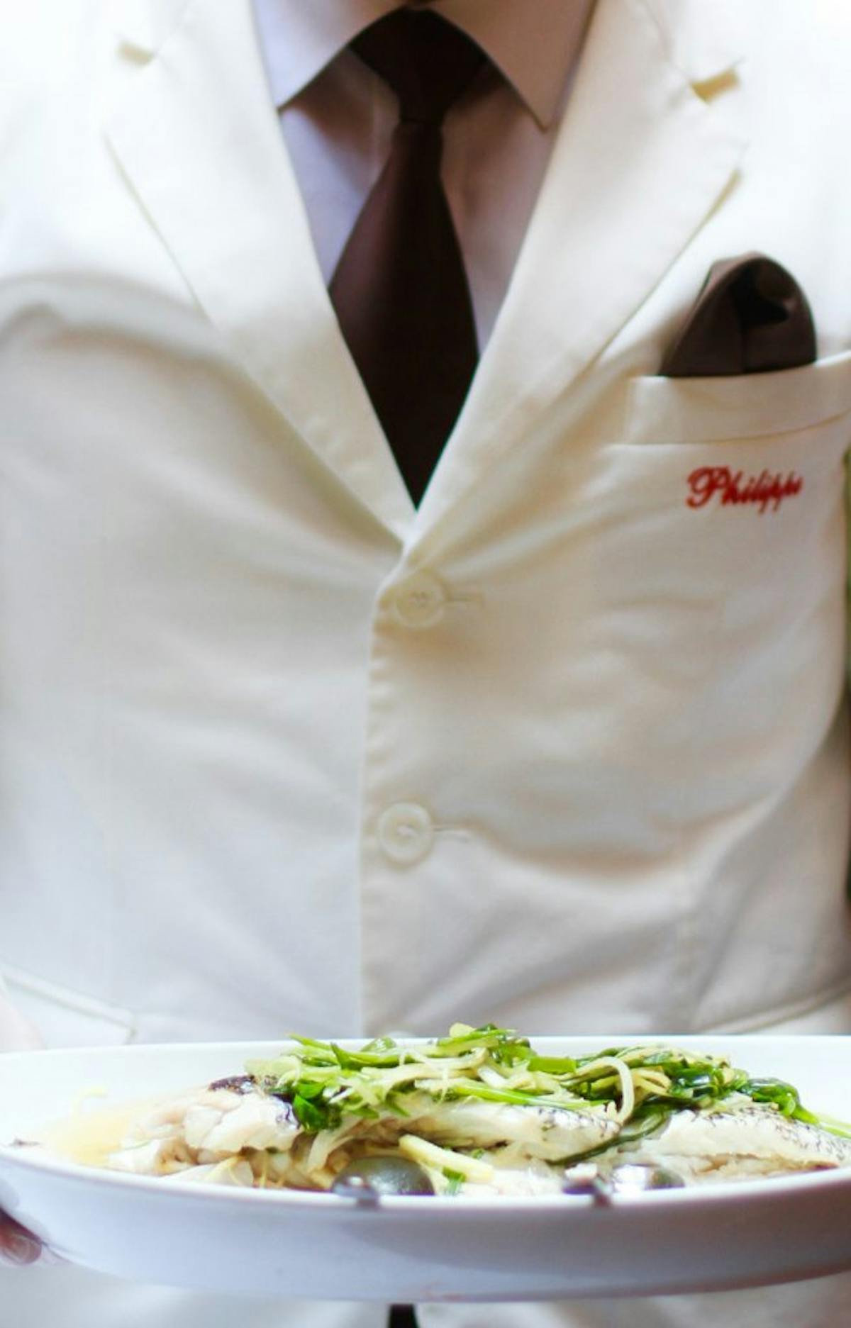 a person holding a plate of food