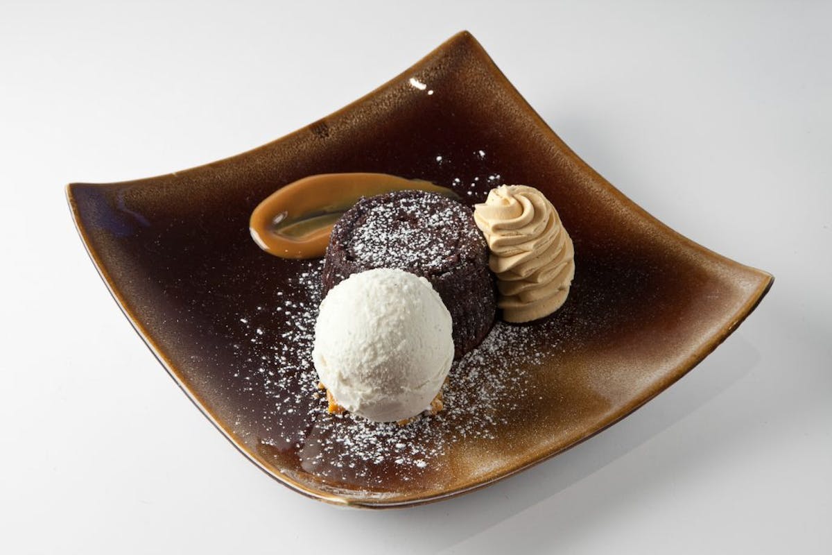 a chocolate doughnut on a plate