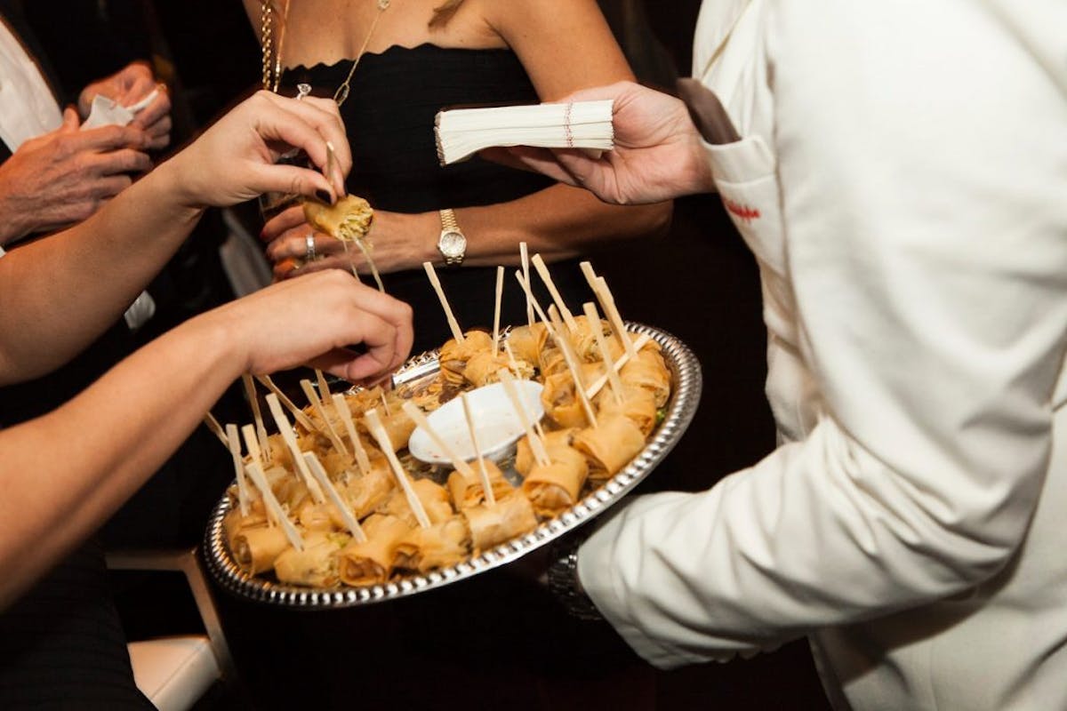 a person cutting a cake