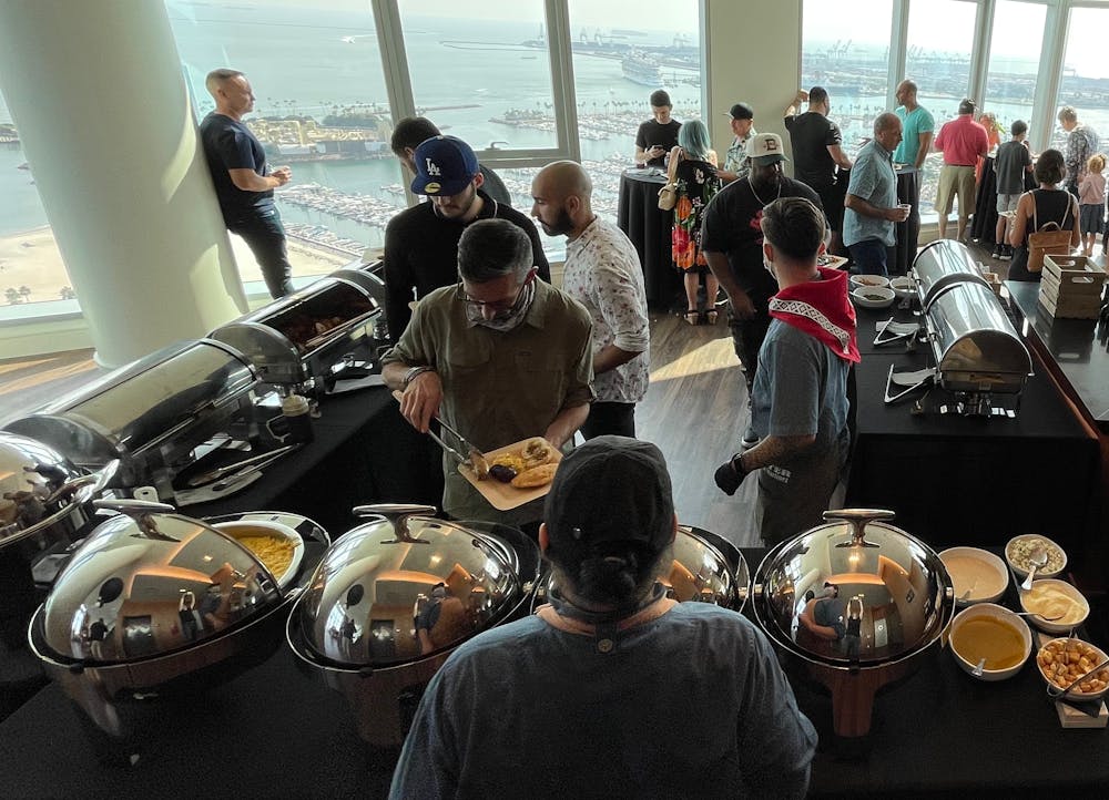 a group of people standing around a motorcycle