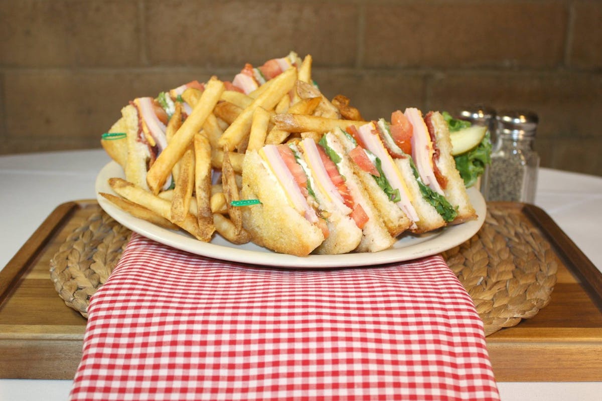 a hot dog and french fries on a table