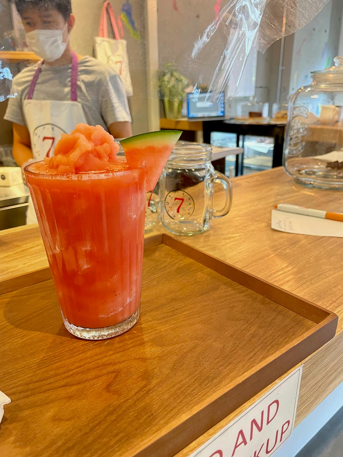 a glass of orange juice on a table