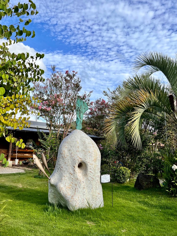 a statue of a person in a garden