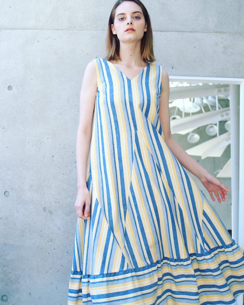 a woman wearing a blue dress