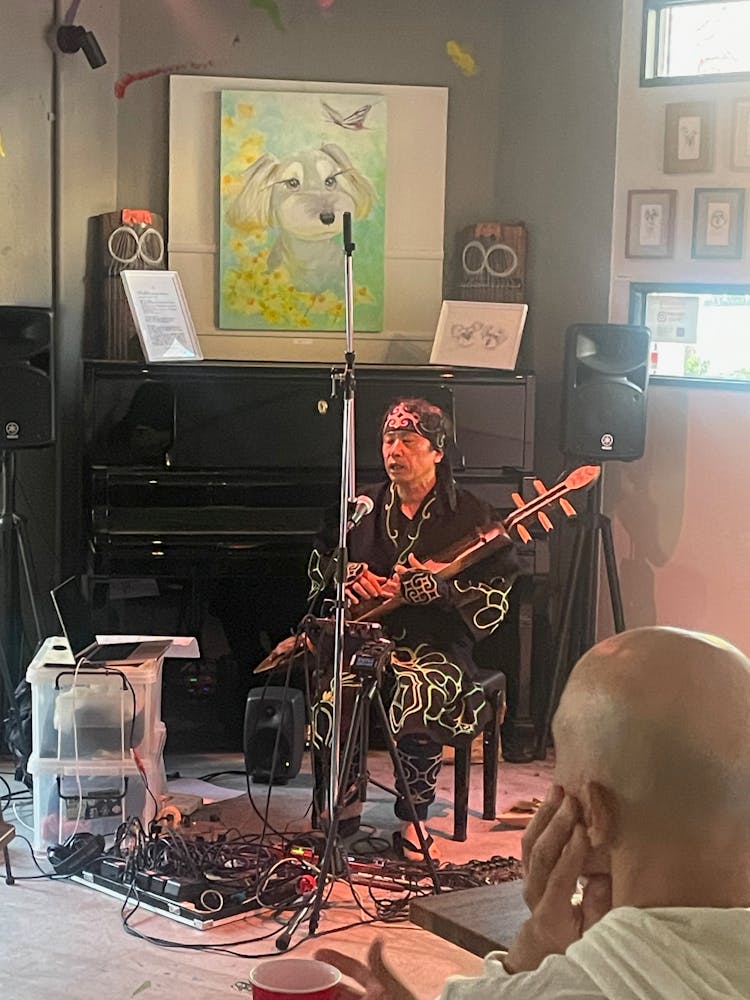 a person sitting at a table in a room