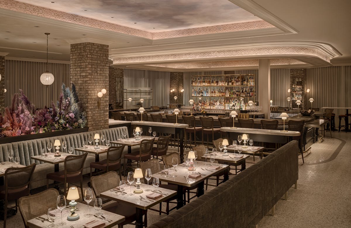 a group of people sitting at a table in a restaurant