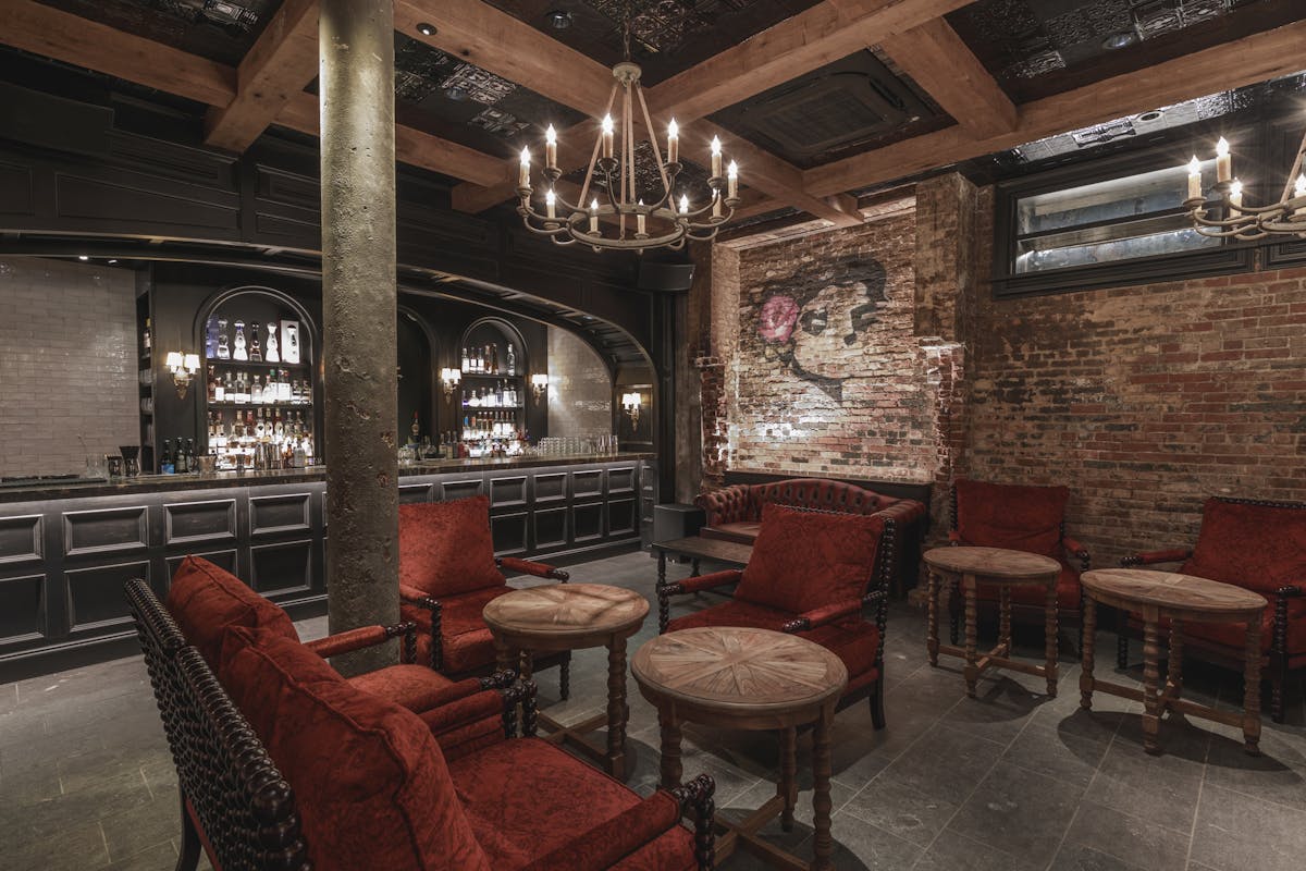 a living room filled with furniture and a fireplace