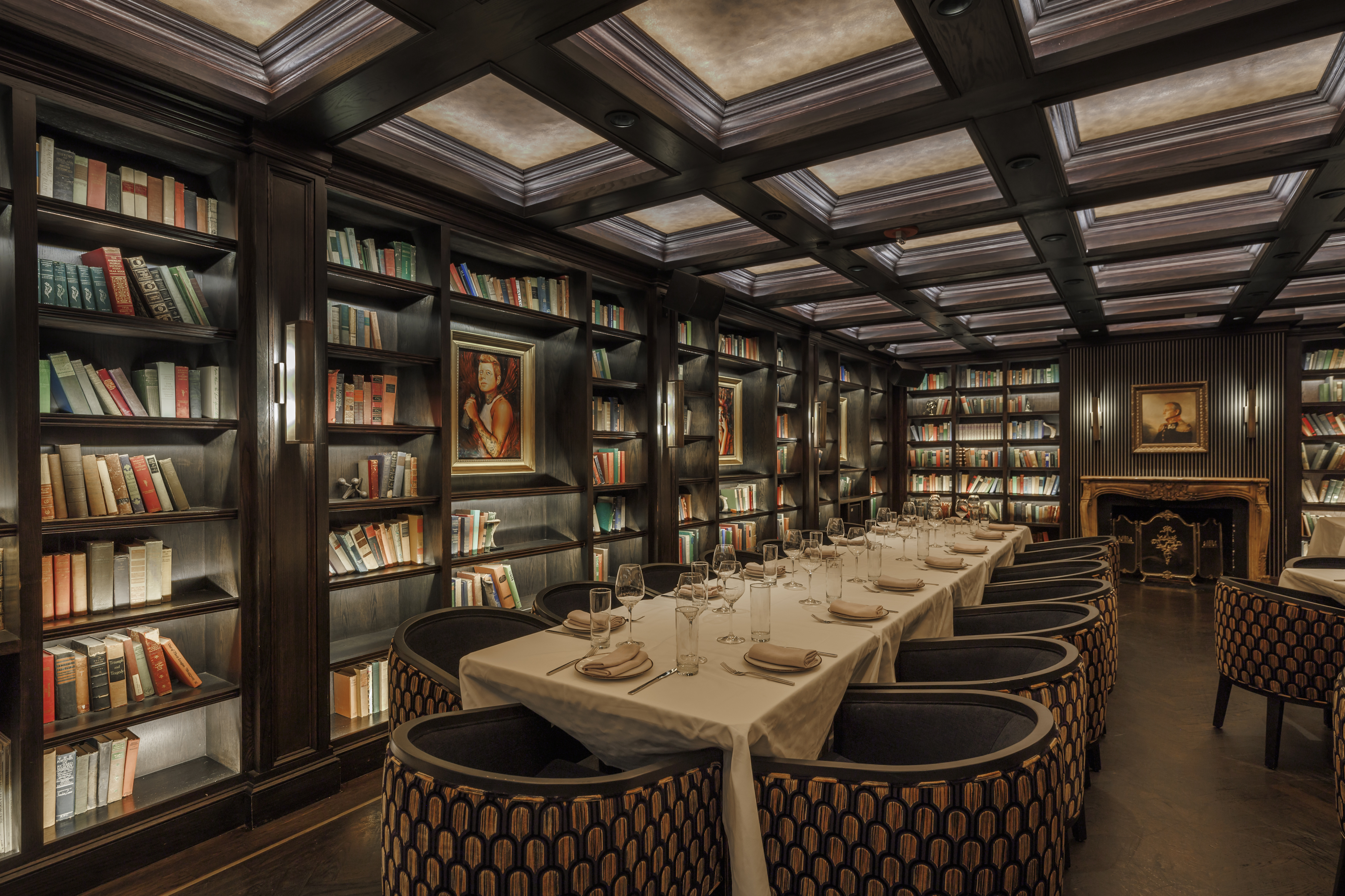 a room filled with furniture and a book shelf