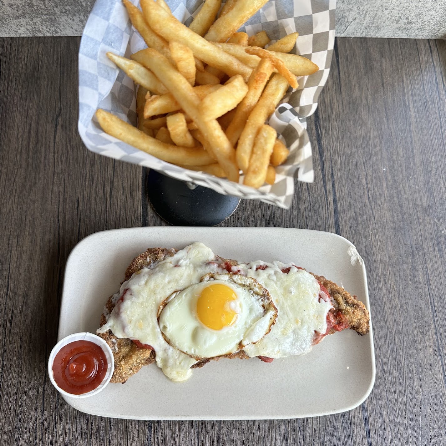 a hot dog and fries on a plate