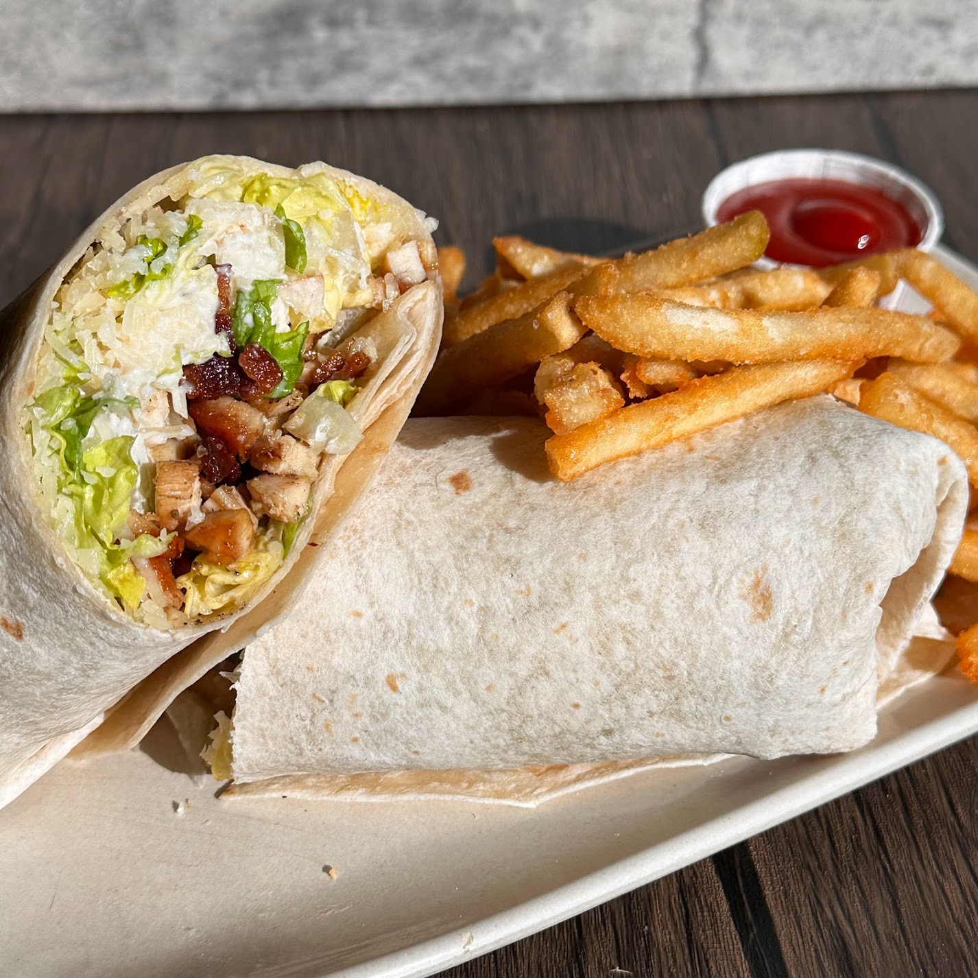 a sandwich sitting on top of a wooden table