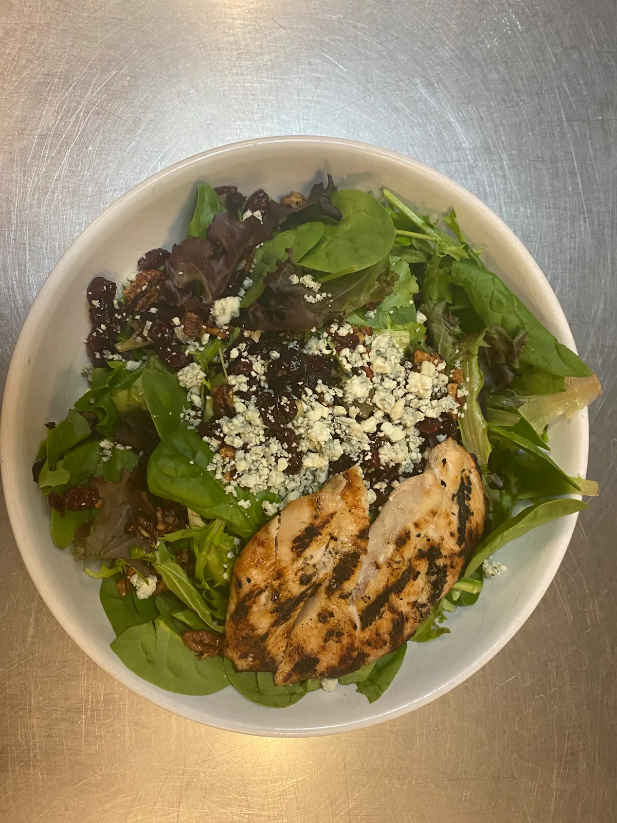 a bowl of salad on a plate