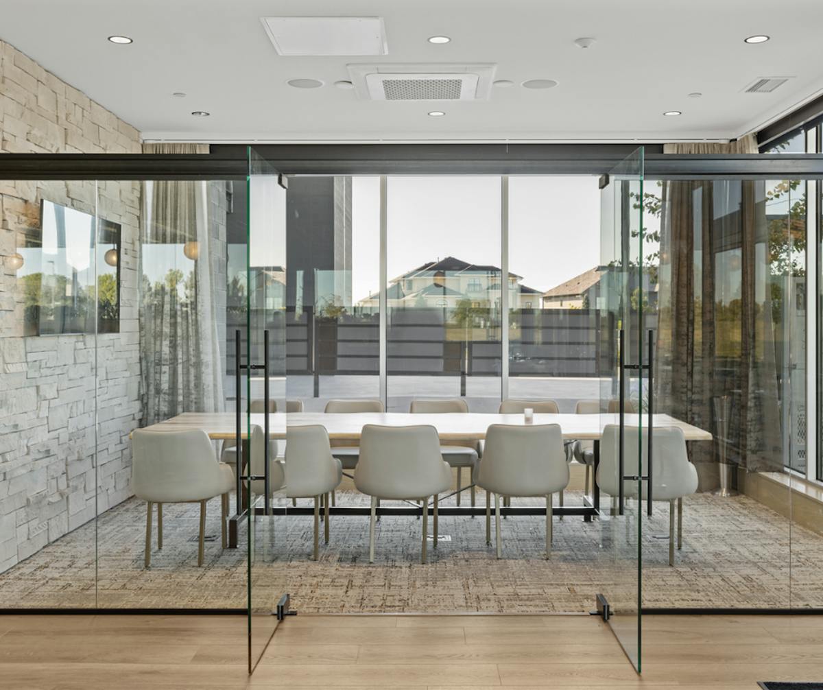 a room filled with furniture and a large window
